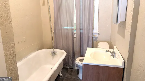 a bathroom with a sink and a bathtub