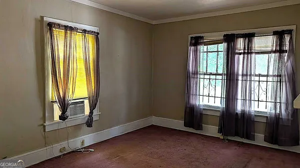 an empty room with windows