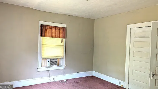 an empty room with a window