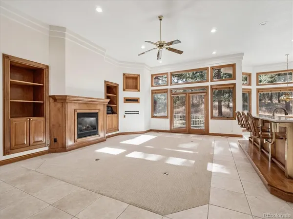 a bed room with furniture and a flat screen tv