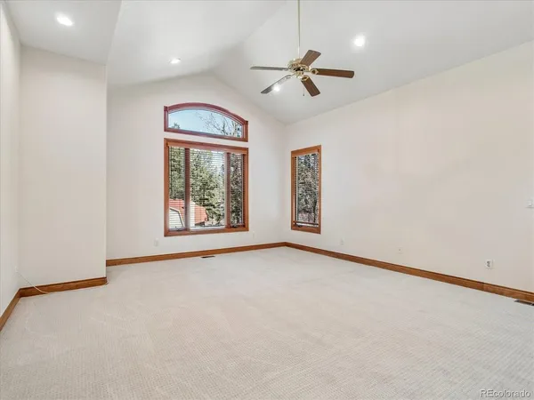 a large bathroom with a large tub and sink