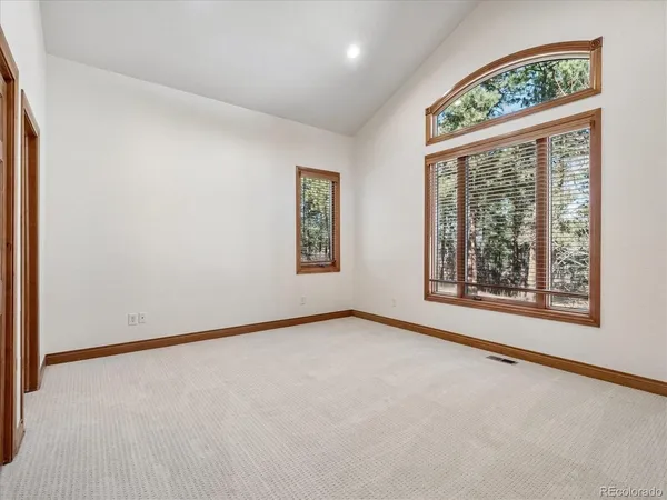 a view of an empty room with stairs
