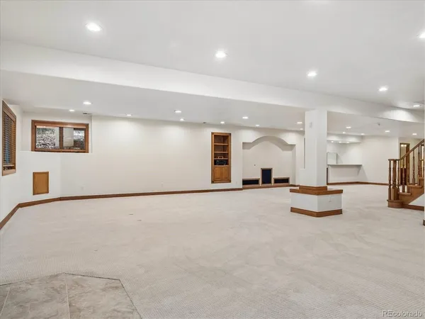 a view of a kitchen with a sink and a mirror