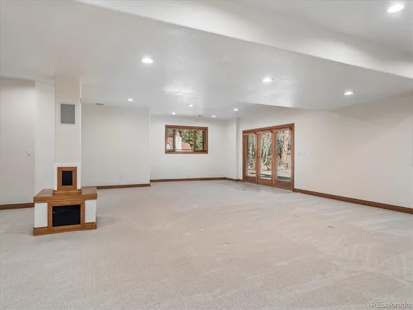 a bathroom with a granite countertop sink a toilet and a mirror