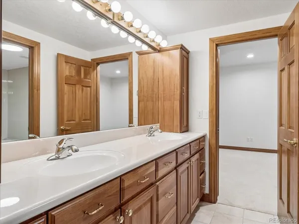 a white sink sitting next to a white sink