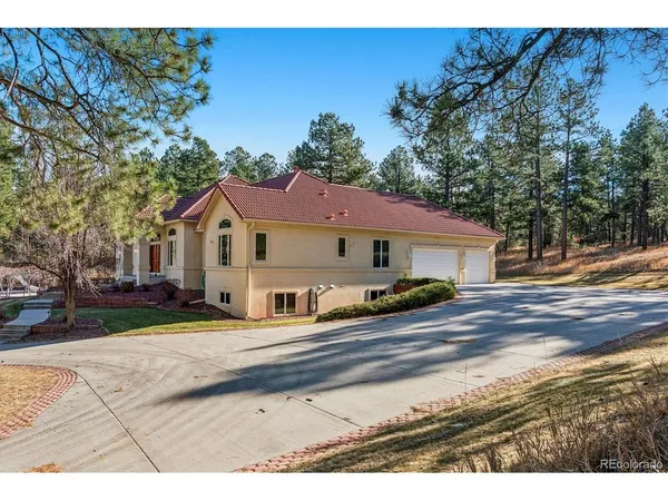 a aerial view of a house with a yard