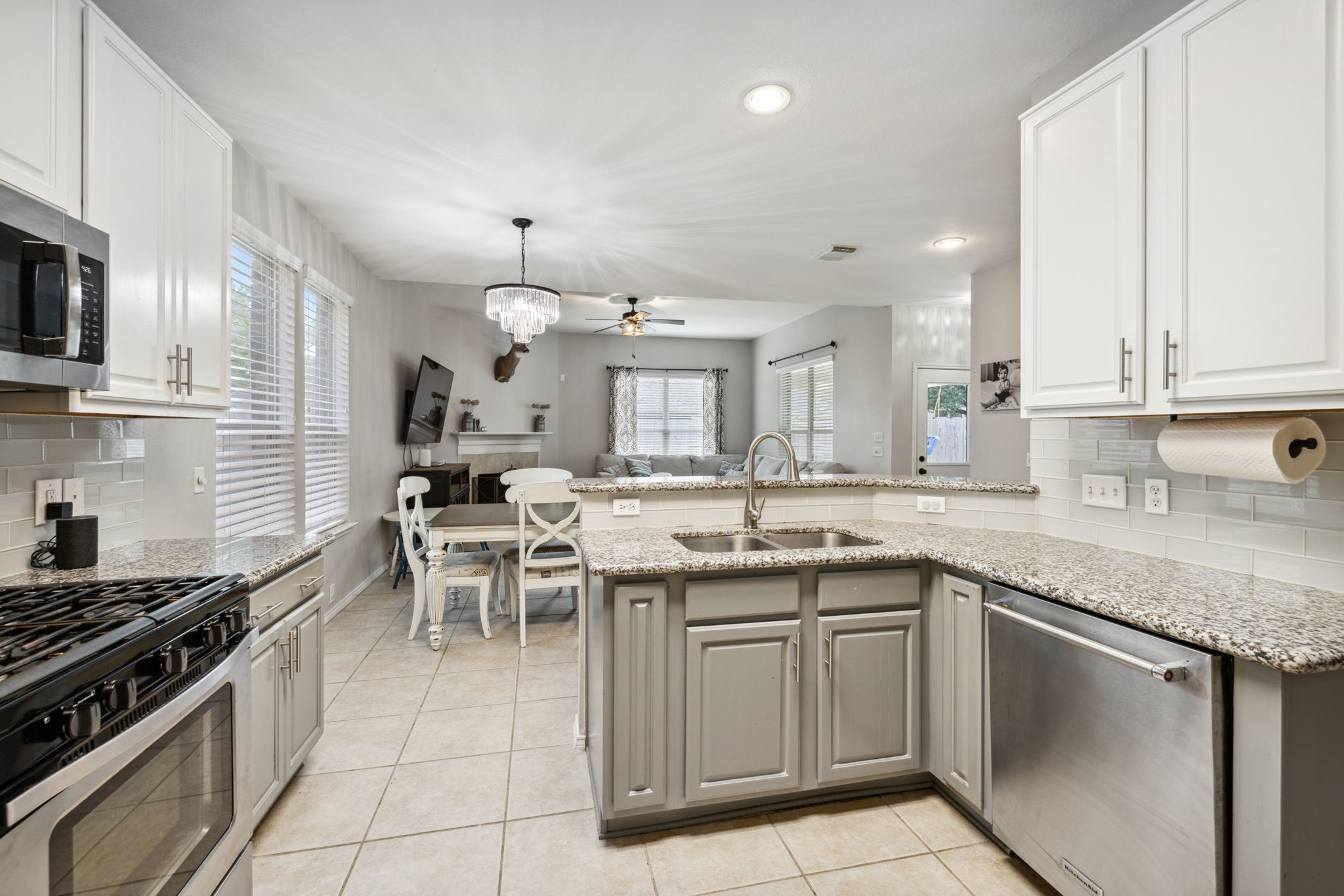 3526 Azalea Sands Drive Spring, TX 77386 - Photo 17 of 39 a kitchen with a sink stove and cabinets
