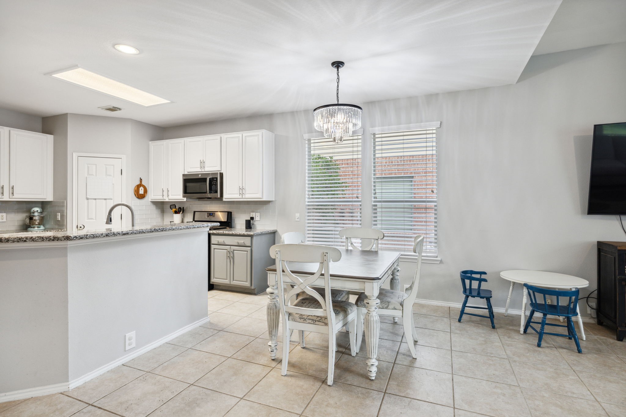 3526 Azalea Sands Drive Spring, TX 77386 - Photo 18 of 39 a kitchen with appliances cabinets and chair