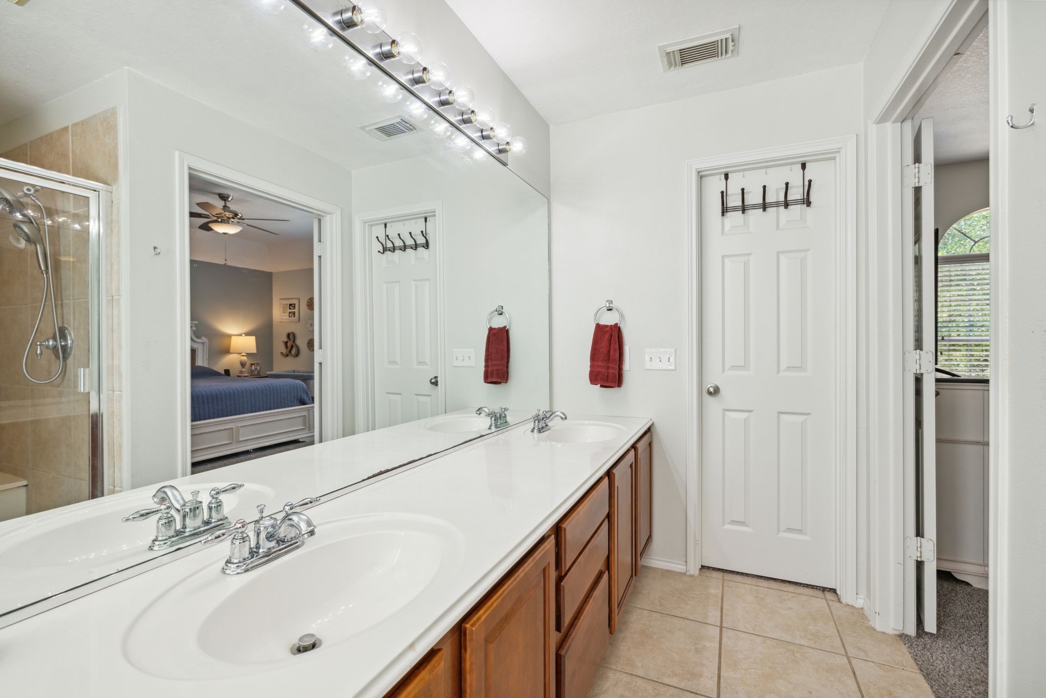 3526 Azalea Sands Drive Spring, TX 77386 - Photo 27 of 39 a bathroom with a sink and a mirror