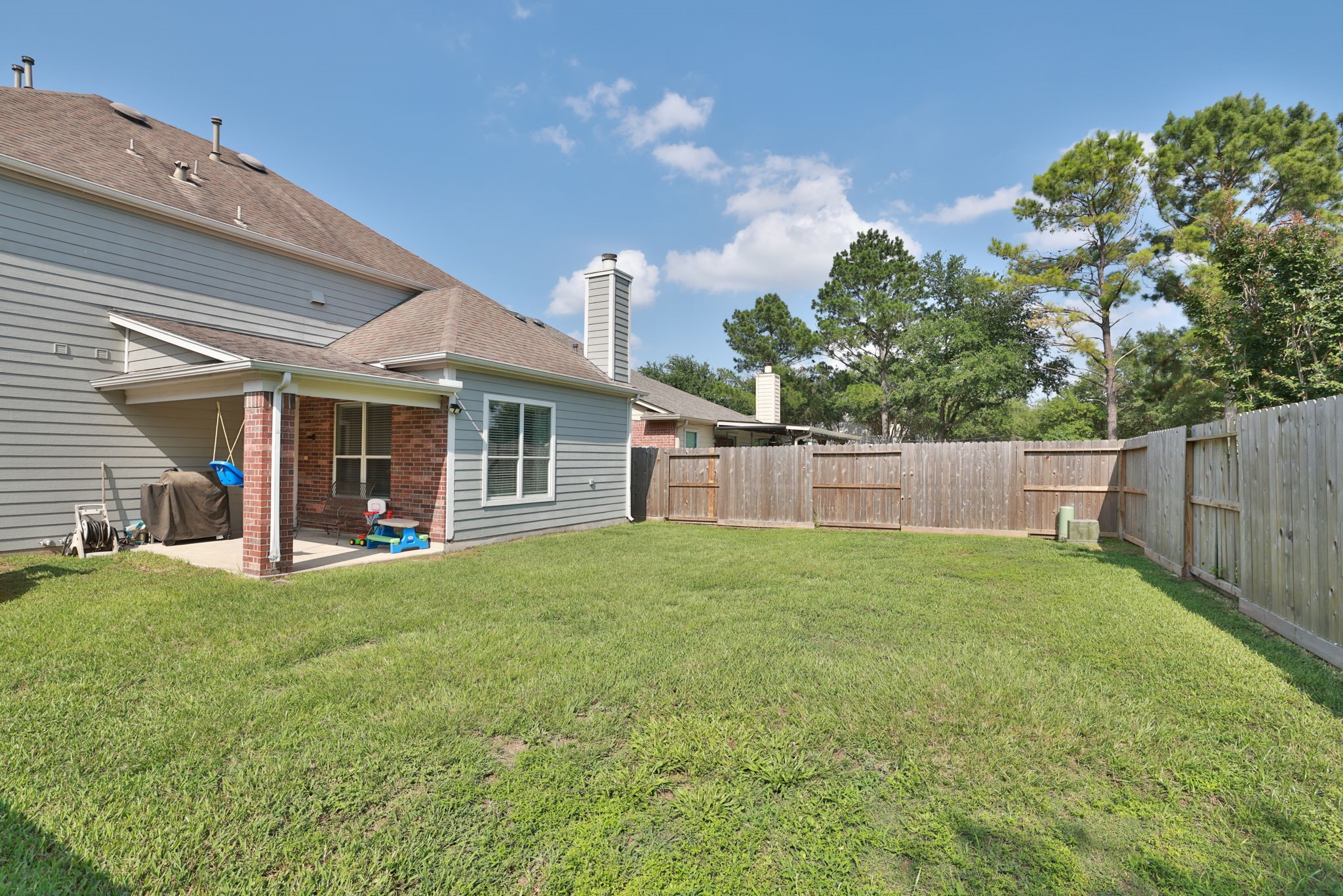 3526 Azalea Sands Drive Spring, TX 77386 - Photo 34 of 39 a view of a backyard with plants and large trees