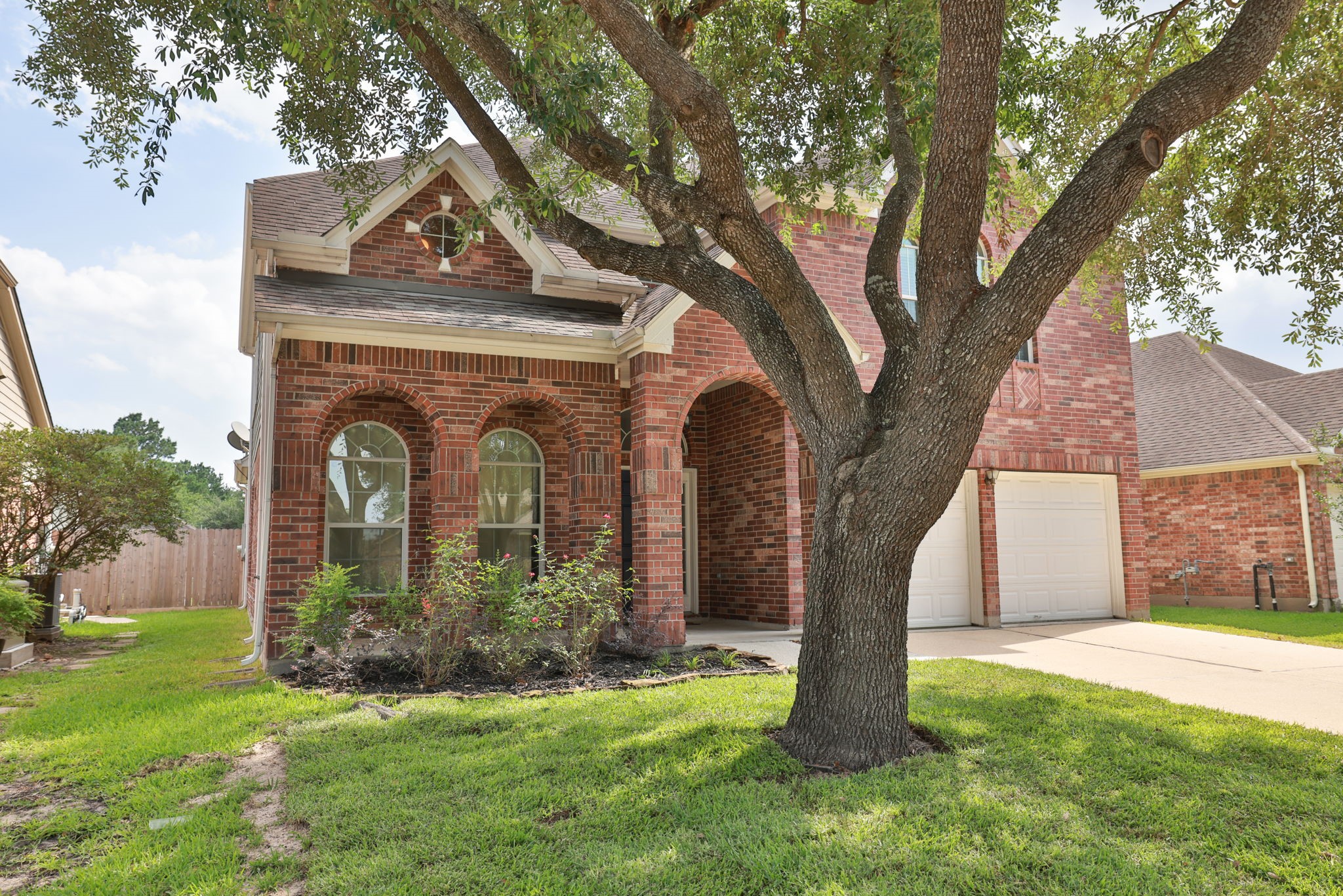 3526 Azalea Sands Drive Spring, TX 77386 - Photo 37 of 39 a front view of a house with garden