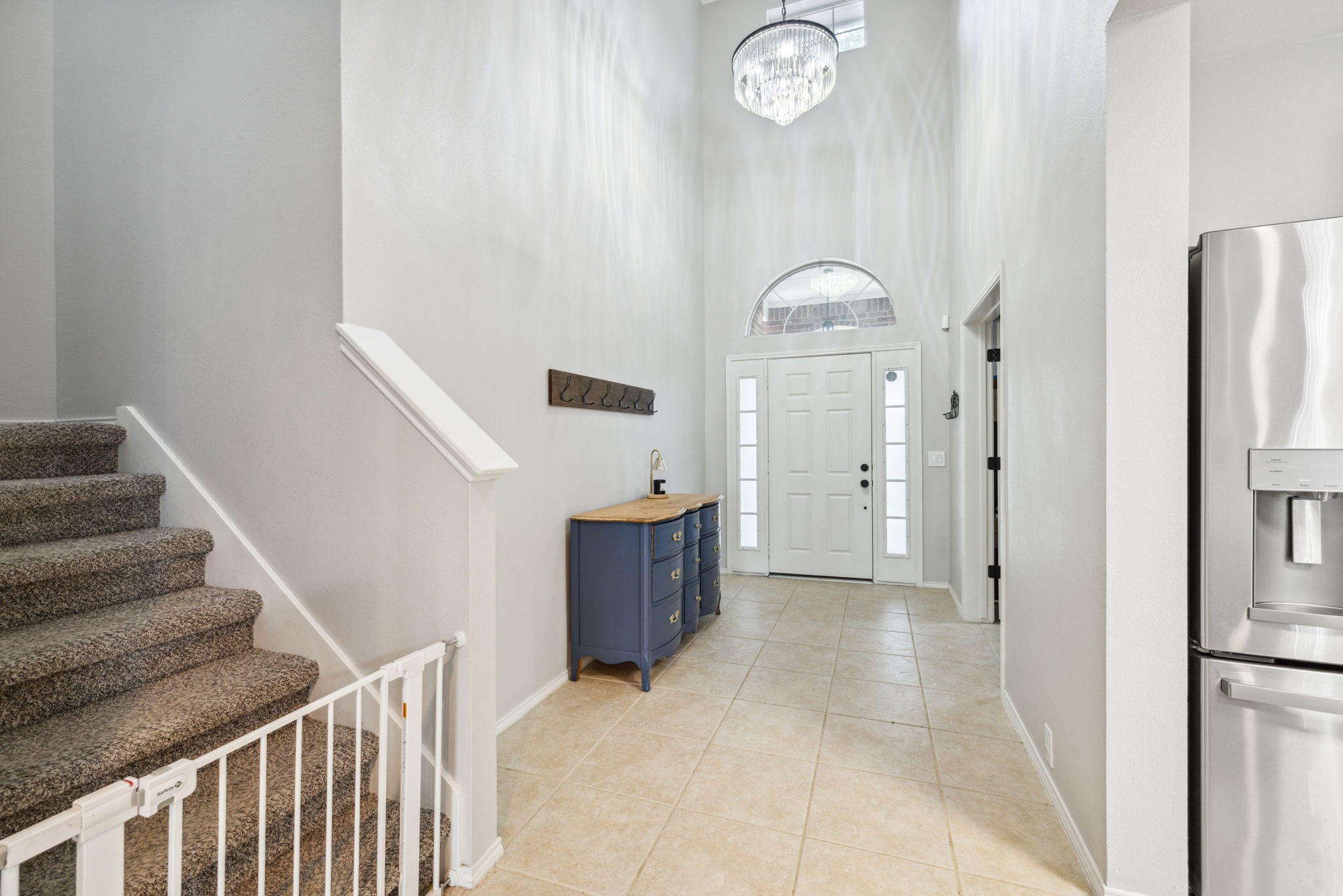 3526 Azalea Sands Drive Spring, TX 77386 - Photo 7 of 39 a view of a hallway with entryway wooden floor and front door