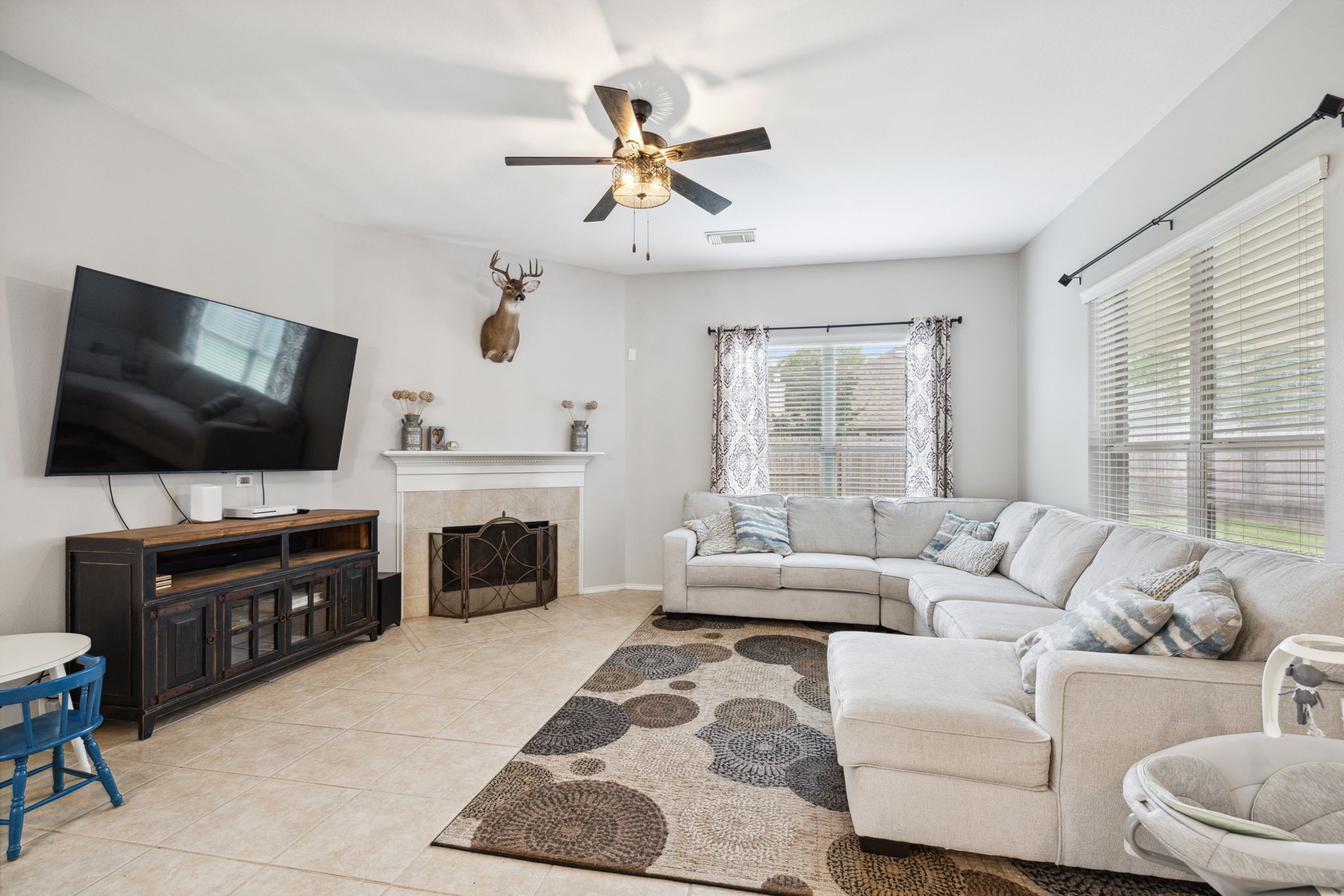 3526 Azalea Sands Drive Spring, TX 77386 - Photo 9 of 39 a living room with furniture a flat screen tv and a fireplace