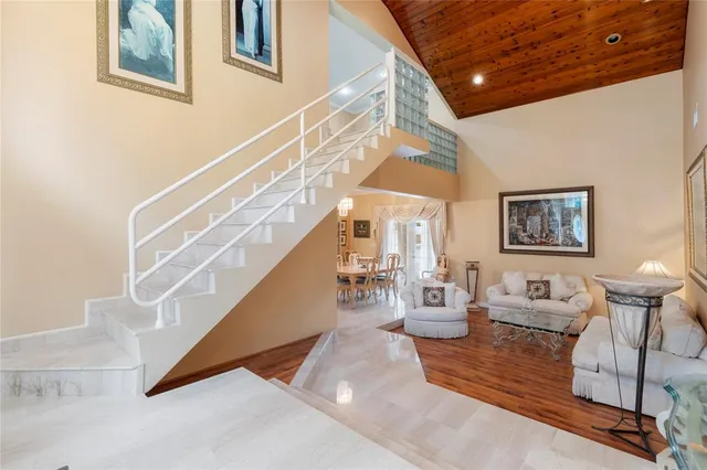 a living room with furniture and large window