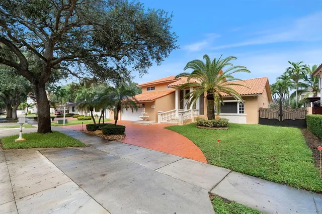 front view of a house with a yard