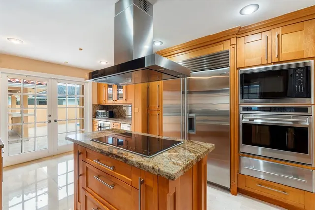 an empty room with entrance and windows