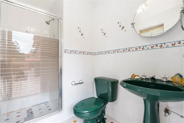 a view of a white house with an outdoor space