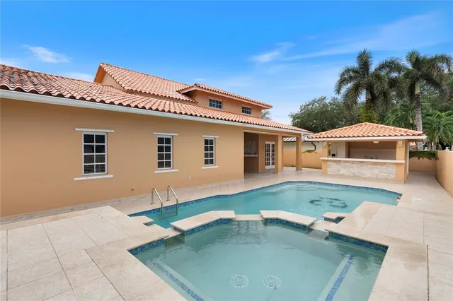 a view of a swimming pool with an outdoor seating