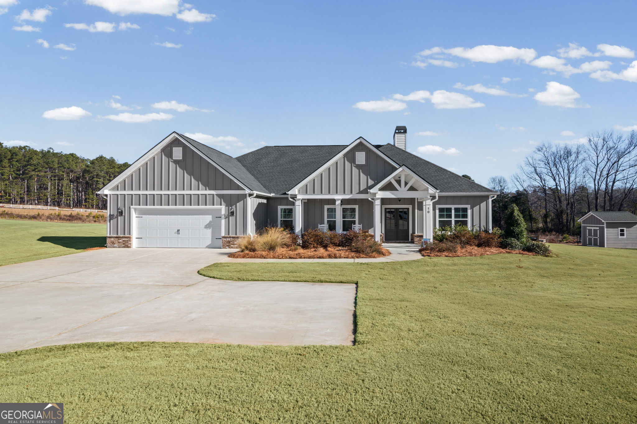50 Rankin Street Newnan, GA 30263 - Photo 1 of 1 a front view of a house with garden
