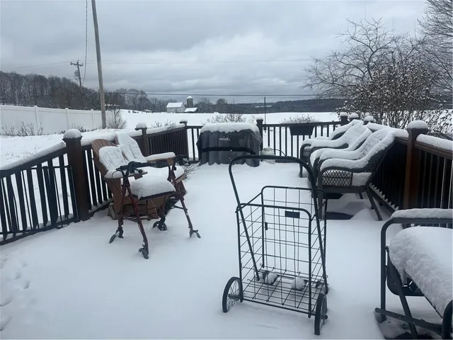 a view of a chairs and tables in the roof deck