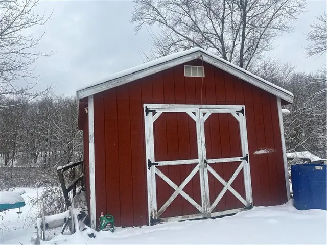 a front view of a house with parking space