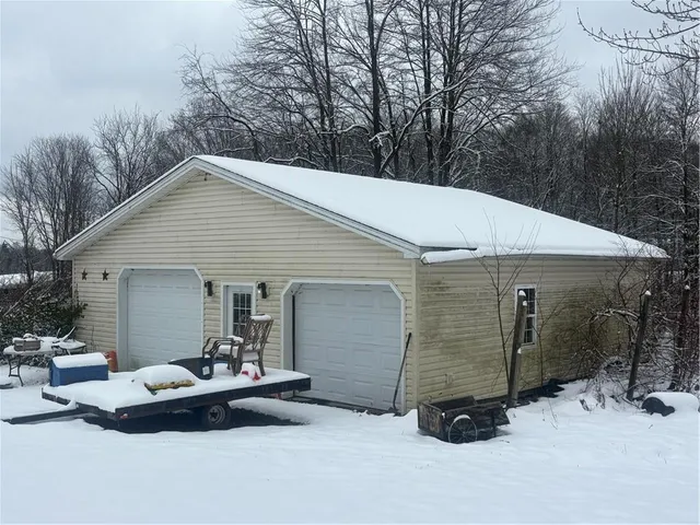 a view of backyard with a patio and a garden