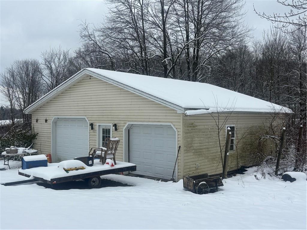 1861 Sandy Lake-Grove City Road Jackson Center, PA 16133 - Photo 4 of 4 a view of backyard with a patio and a garden