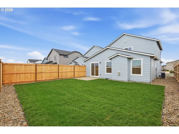 a view of a backyard of the house