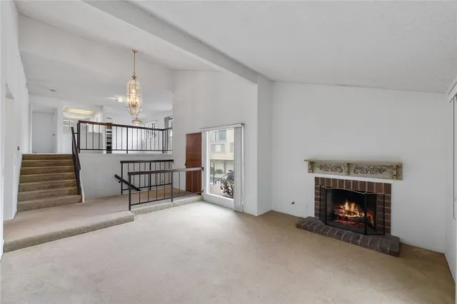 a view of entryway with wooden floor and stairs