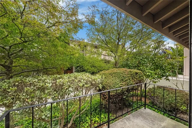 a view of a livingroom with furniture and staircase