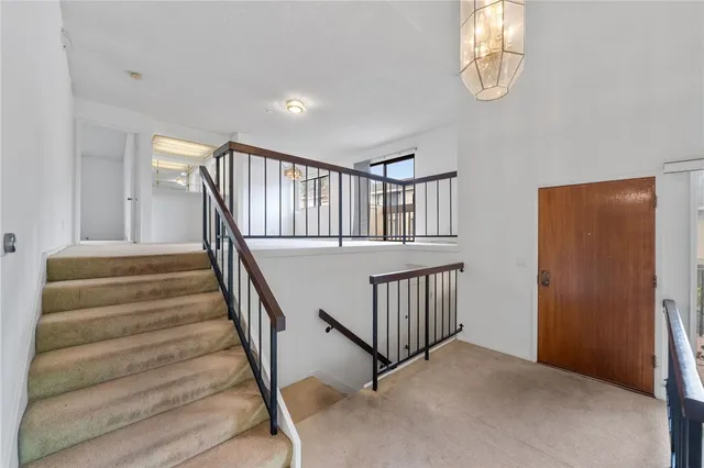 a view of an empty room with stairs