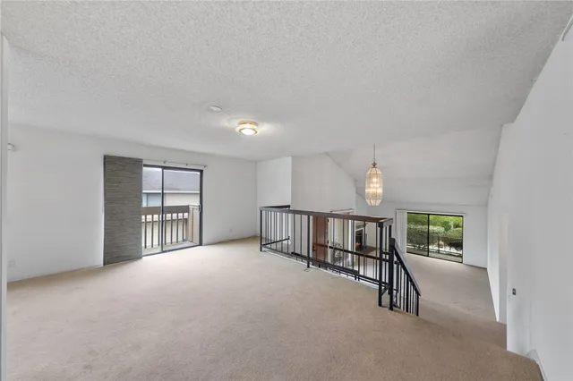 a view of a big room with windows and cabinet