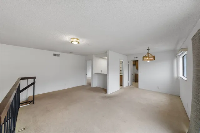 a hallway with a sink and dishwasher