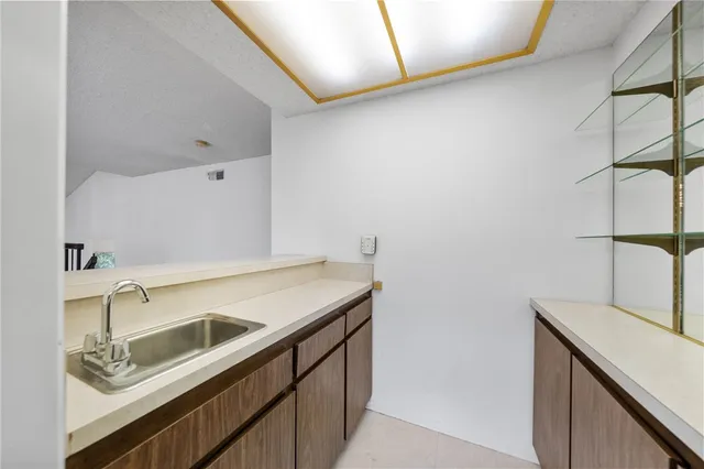 a kitchen with stainless steel appliances granite countertop a stove and a refrigerator