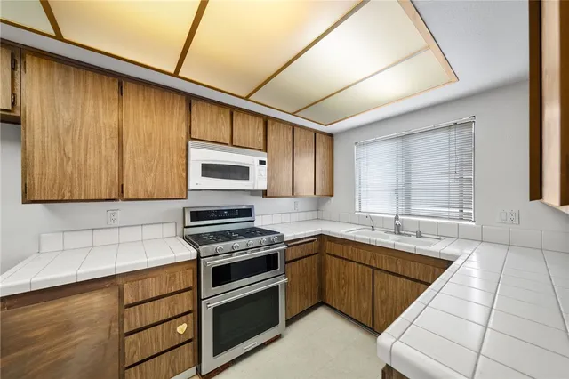 a kitchen with a stove and a microwave