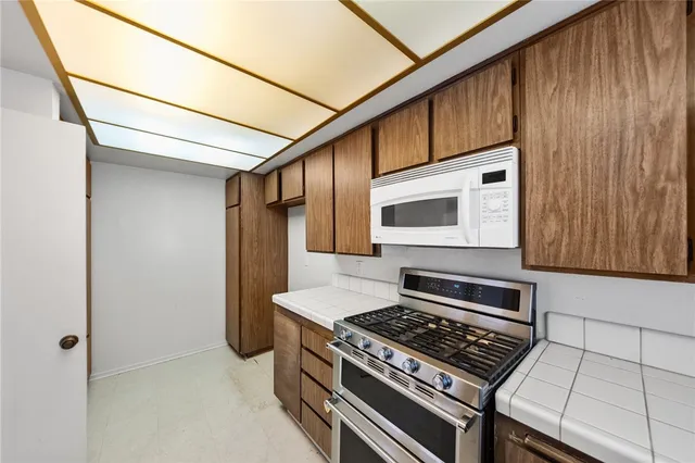 a bathroom with a double vanity sink a mirror and a shower