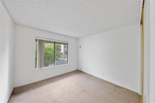 an aerial view of residential building with parking space