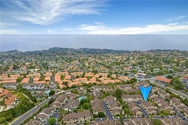 a view of a house with swimming pool and sitting area