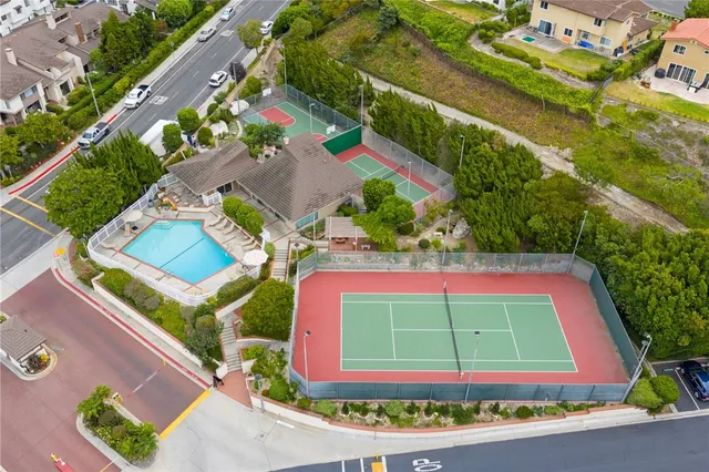 a living room with lots of furniture and a painting on the wall