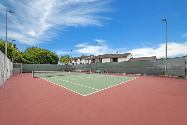 a kitchen with granite countertop cabinets and refrigerator