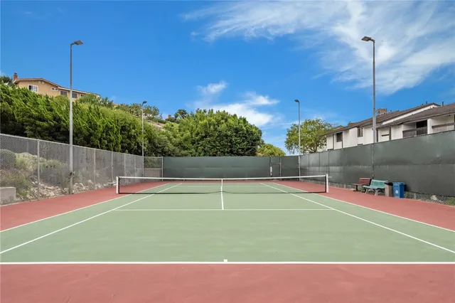 a kitchen with granite countertop cabinets stainless steel appliances and a counter space