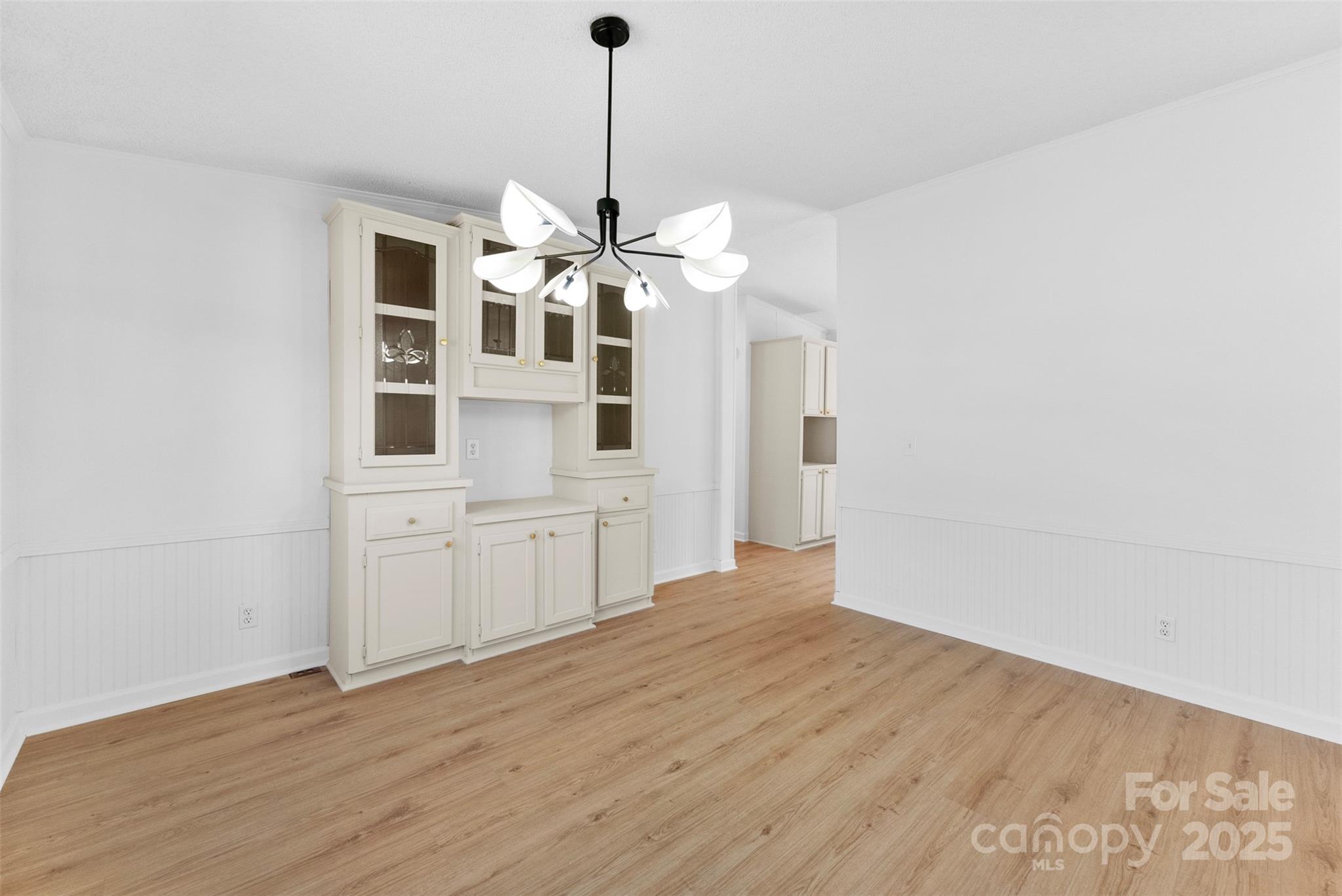 2121 Hephzibah Church Road Bessemer City, NC 28016 - Photo 11 of 41 a view of wooden floor and a chandelier in a room