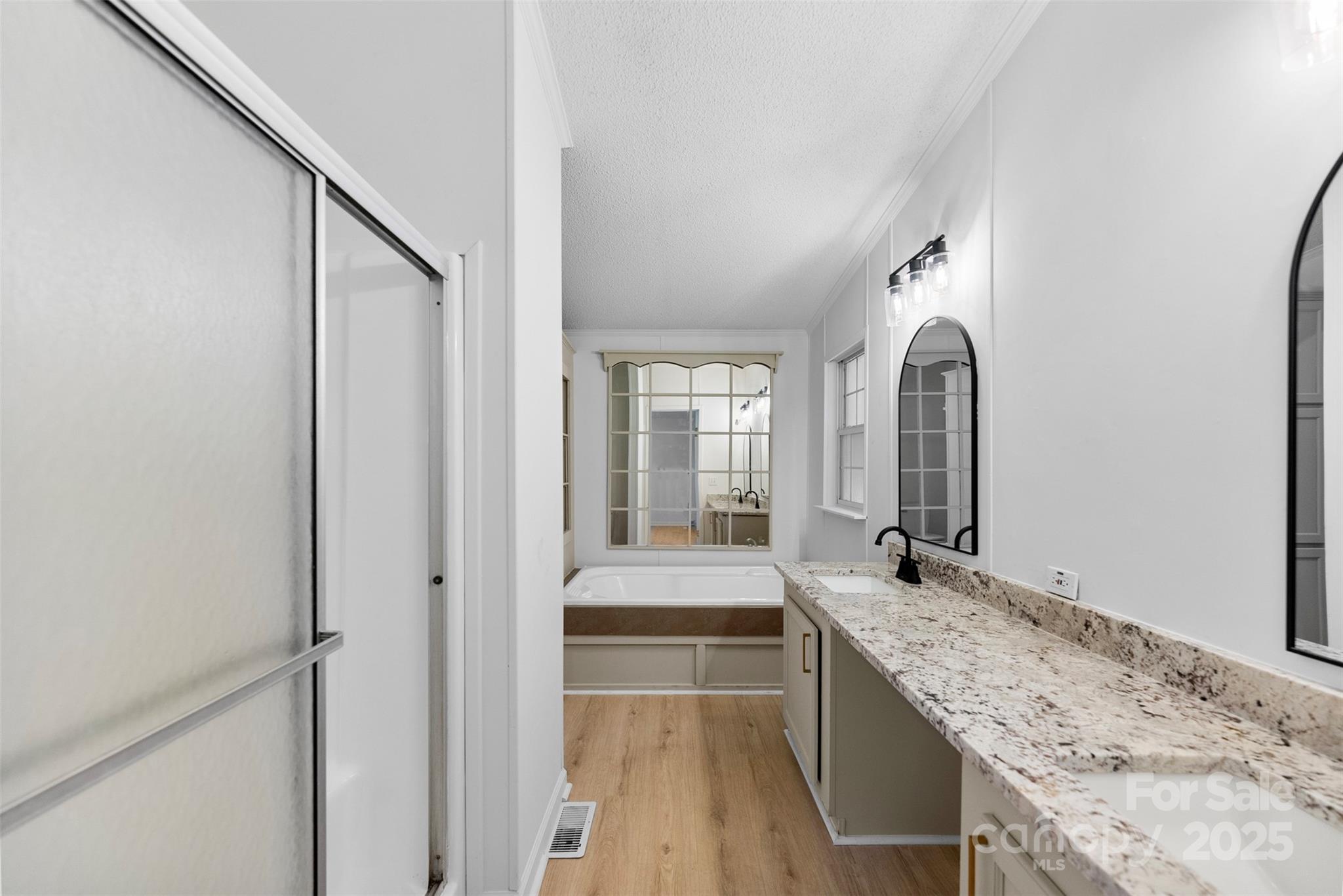2121 Hephzibah Church Road Bessemer City, NC 28016 - Photo 16 of 41 a bathroom with a granite countertop sink a toilet and shower
