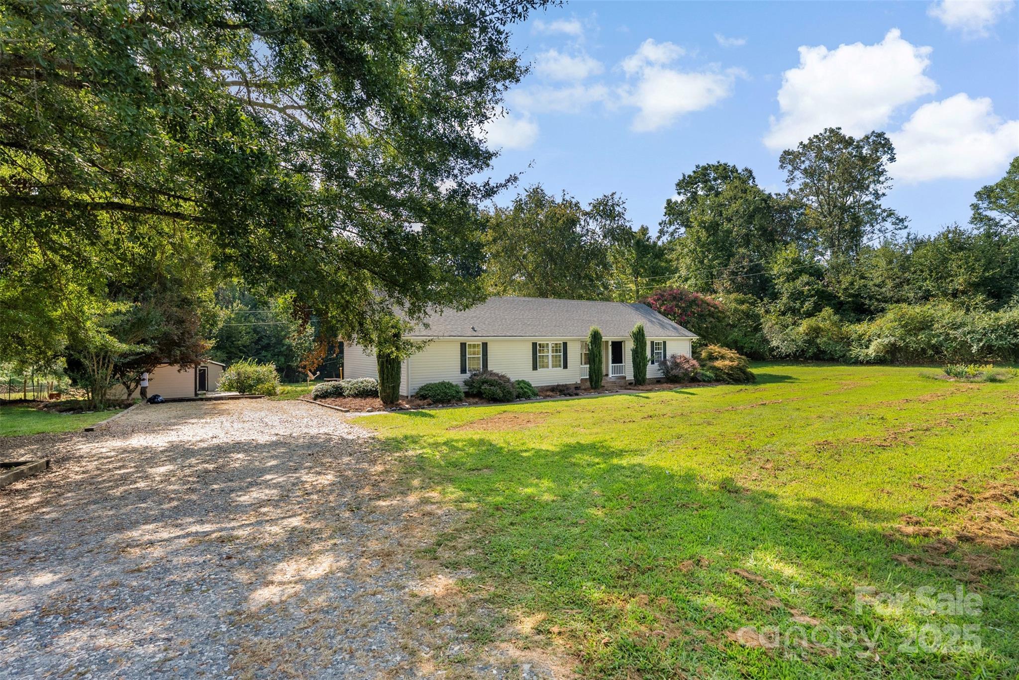 2121 Hephzibah Church Road Bessemer City, NC 28016 - Photo 2 of 41 a front view of a house with yard and trees