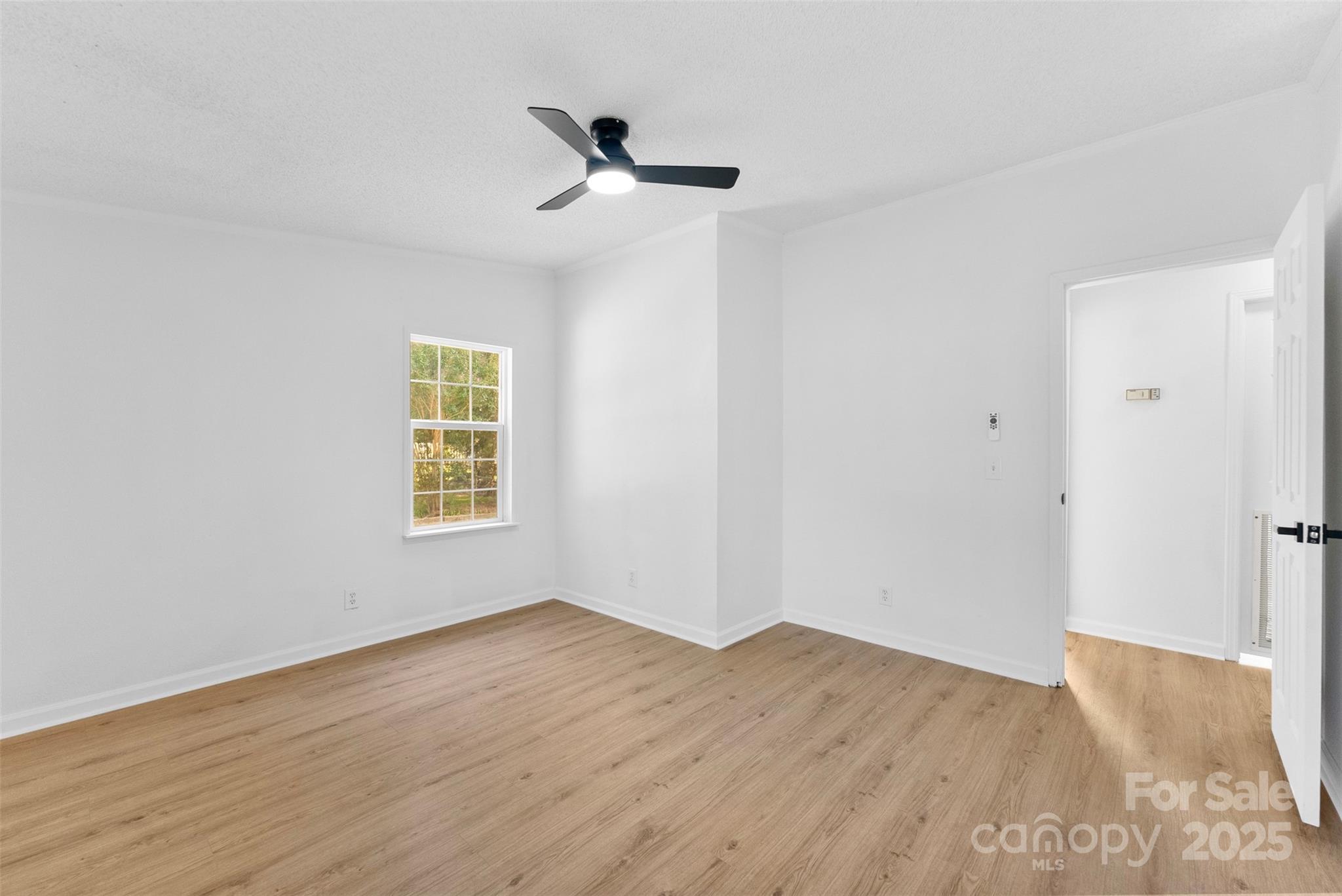 2121 Hephzibah Church Road Bessemer City, NC 28016 - Photo 22 of 41 a view of empty room with wooden floor and fan
