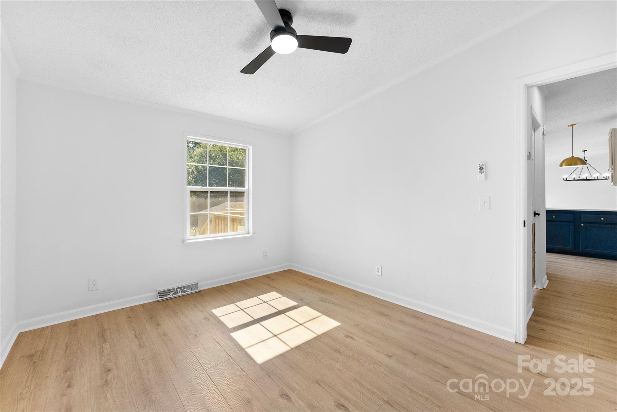 2121 Hephzibah Church Road Bessemer City, NC 28016 - Photo 26 of 41 an empty room with wooden floor cabinet and windows