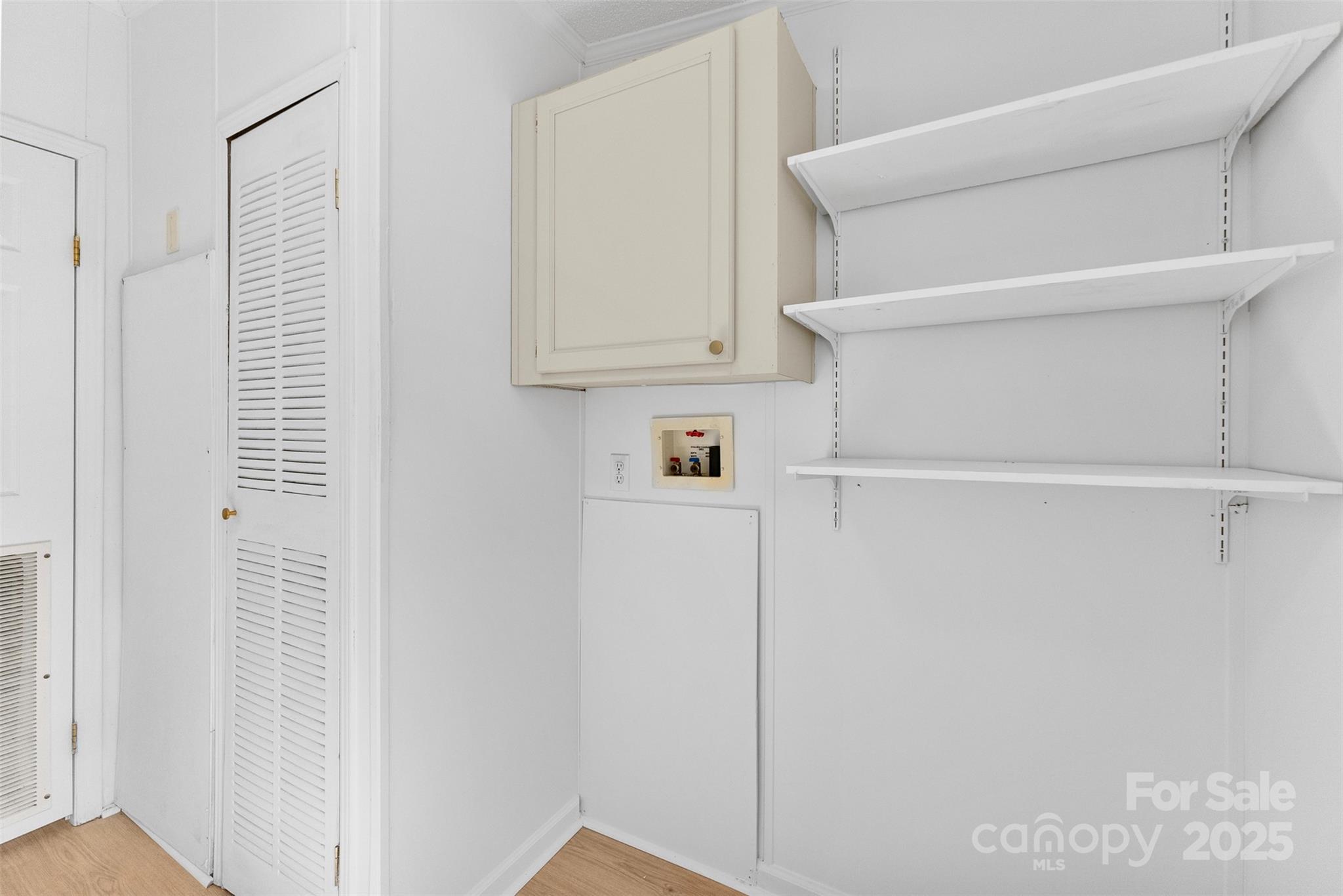 2121 Hephzibah Church Road Bessemer City, NC 28016 - Photo 30 of 41 a view of walk in closet with empty racks