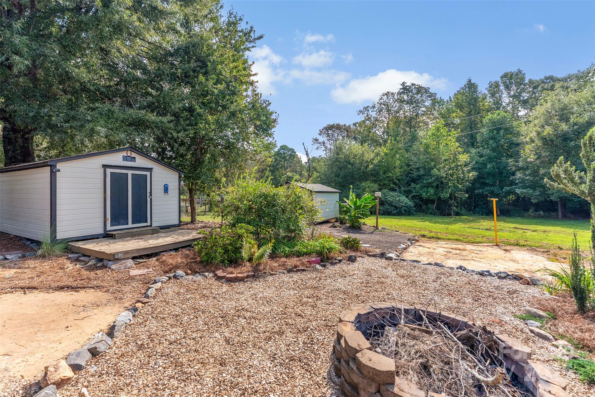 2121 Hephzibah Church Road Bessemer City, NC 28016 - Photo 33 of 41 a backyard of a house with lots of green space