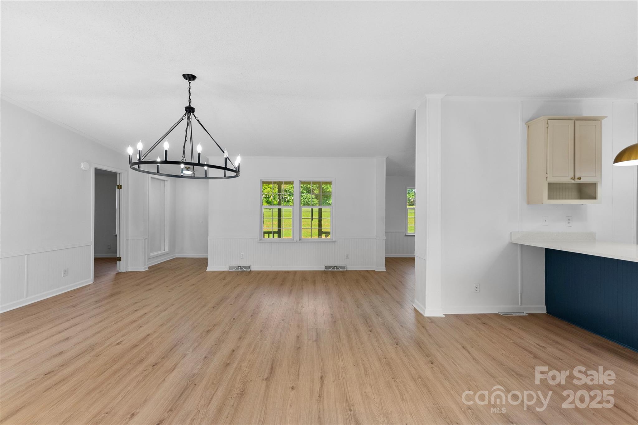 2121 Hephzibah Church Road Bessemer City, NC 28016 - Photo 5 of 41 a view of empty room with wooden floor and fan