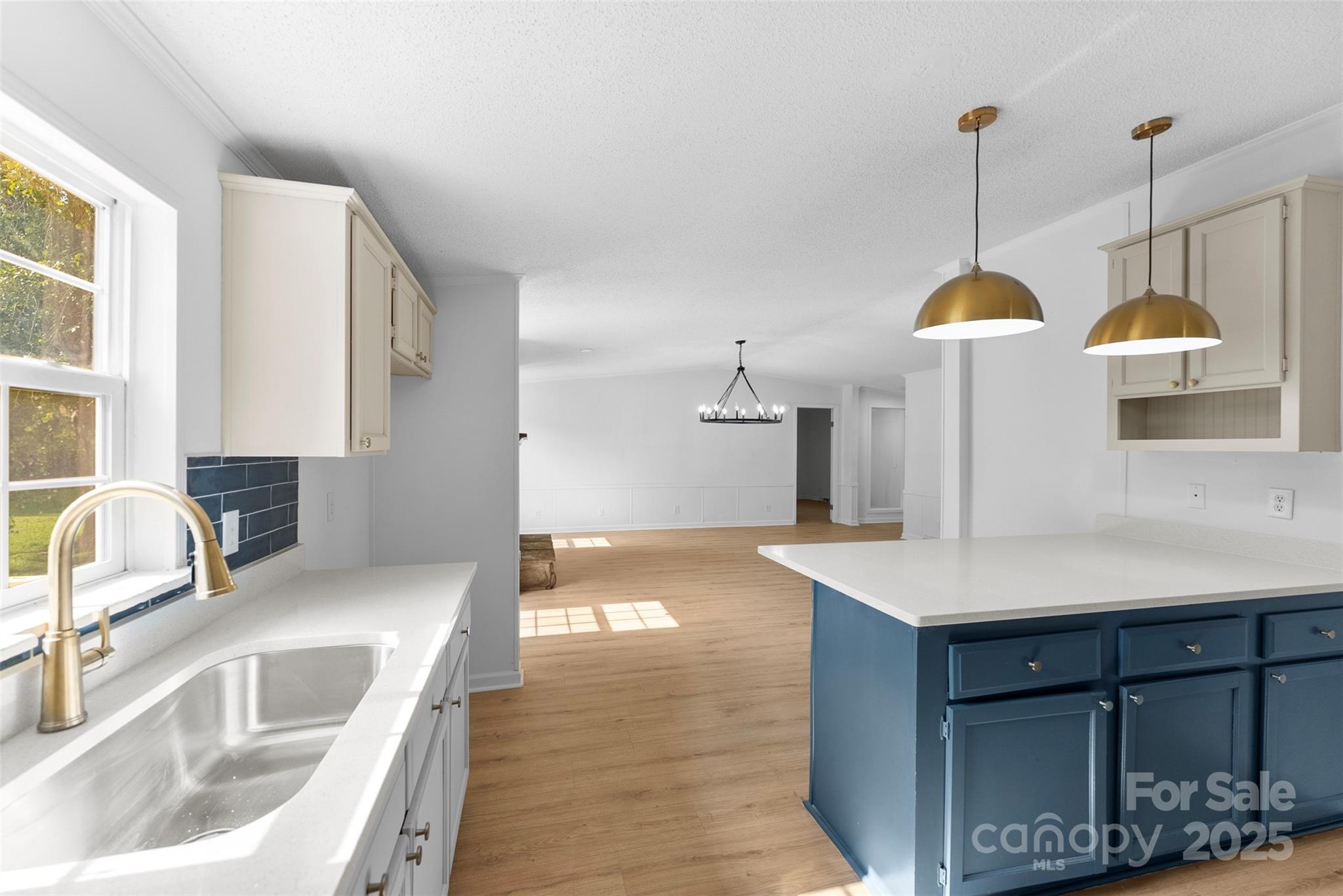 2121 Hephzibah Church Road Bessemer City, NC 28016 - Photo 7 of 41 a kitchen with a sink a counter space and a sink